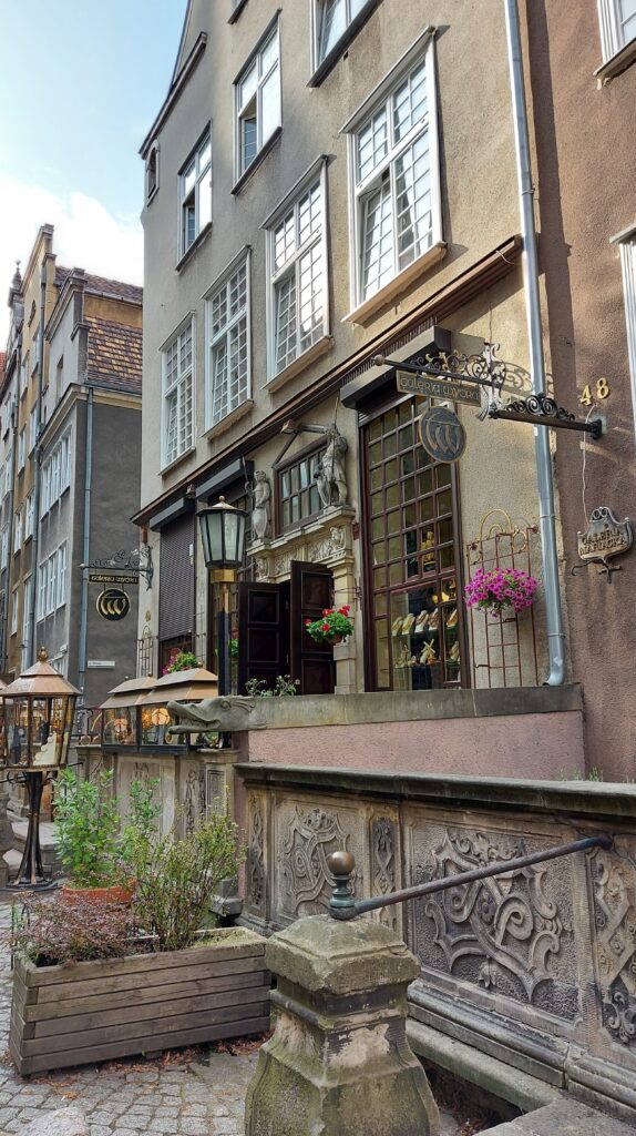 Pretty street with flowers in Old Town in Gdansk